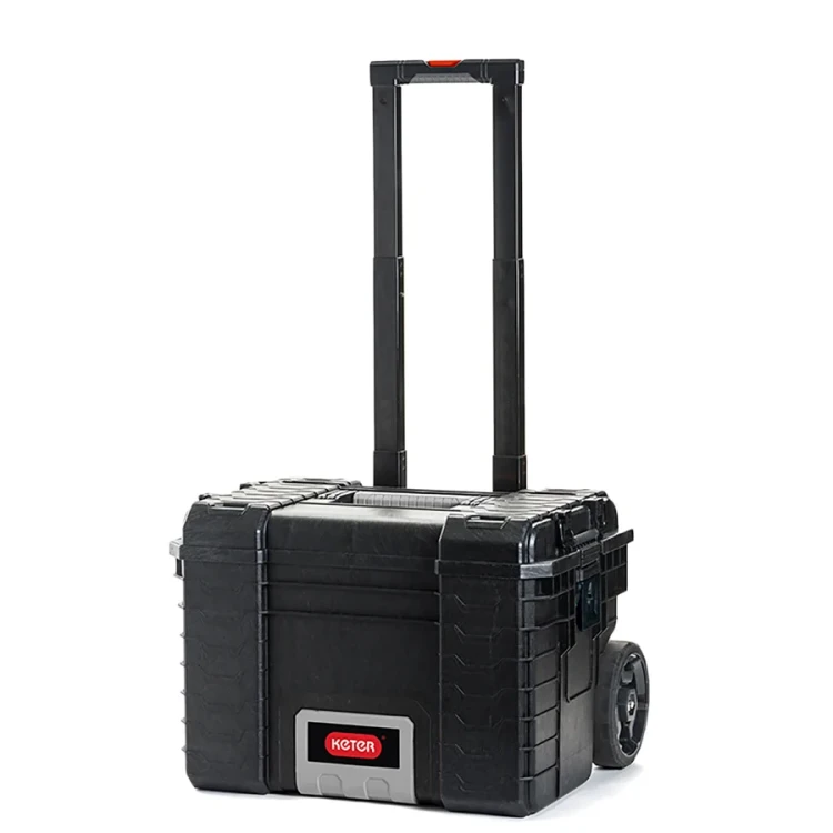 Ta sama skrzynka z wysuniętym teleskopowym uchwytem; widok z przodu, uchwyt w pozycji pionowej.