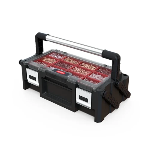 Zamknięta skrzynka z podniesionym metalowym uchwytem, przezroczystą pokrywą i czerwonymi przegródkami z drobnymi elementami.